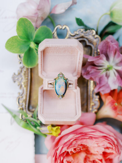 closeup of opal ring with flowers around it in Sintra, Portugal