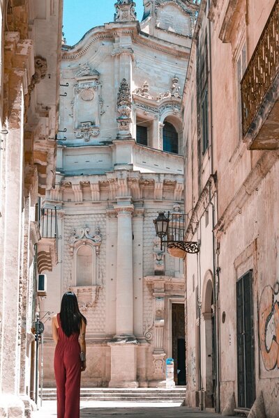 European Church with woman standing in front
