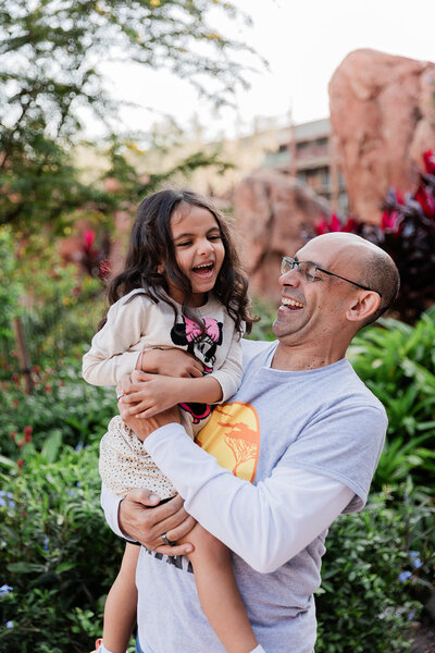 Mother daughter smiling and posing at Disney