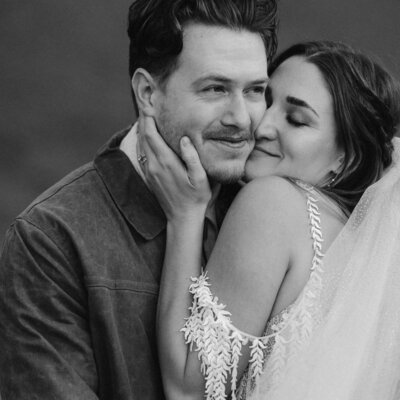 Smiling Bride embracing groom in Telluride, Colorado