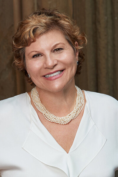 Professional portrait of Helen in formal attire, exuding elegance and sophistication, captured by Ylva Erevall.