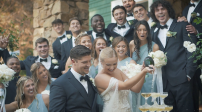 Bride and Groom celebrate wedding with wine
