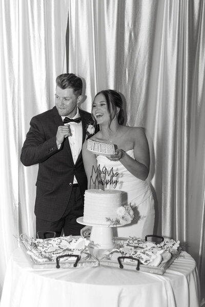 Bride and groom cutting the cake.