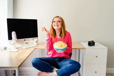 Wedding photographer Samantha Grant tossing popcorn in the air at brand shoot
