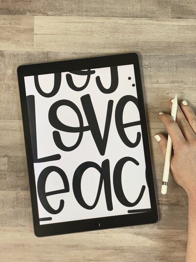 Black and white Procreate design on iPad mockup with word love