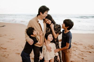 A beautiful moment from a Sydney family photoshoot, capturing togetherness by the sea