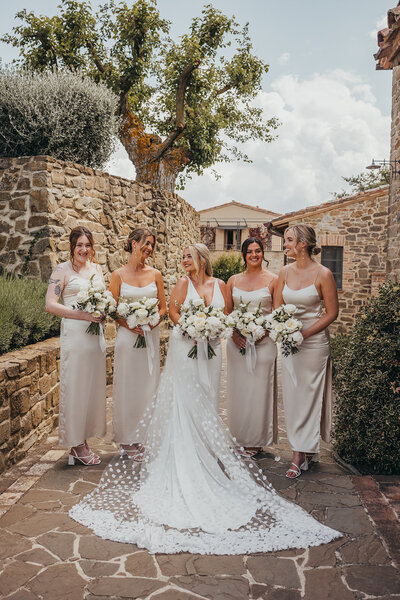 bridesmaids pose with bride