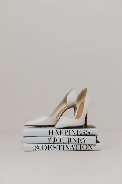 High heels on a stack of books.