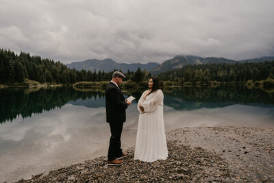 Exchanging of vows during intimate elopement in Washington.