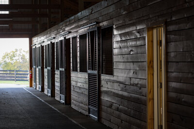 The interior of a horse barn.