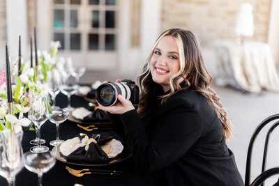 Ali Spires, Lead Photographer and Senior Editor at Bambino International, is renowned for her elegant and sophisticated photography style. This image portrays her at work, editing a stunning bridal shoot, reflecting her meticulous attention to detail and artistic finesse.