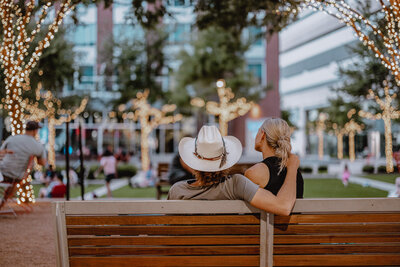 couple sitting on a bench in the CityLine plaza