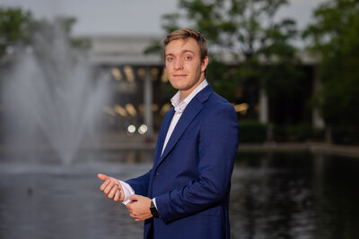 A University of South Carolina student taking his senior portraits on campus