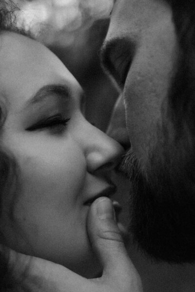 Black-and-white close-up of a couple leaning in for a kiss during a Jacksonville, Florida session.