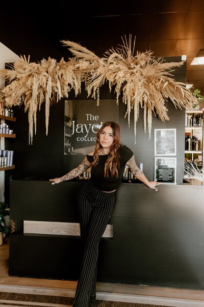 Jaycie Rusconi, salon owner and stylist at The Jaycie Collective in Salem, Oregon, working with a client.
