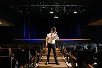 Senior boy posing in cuyahoga falls high school theater