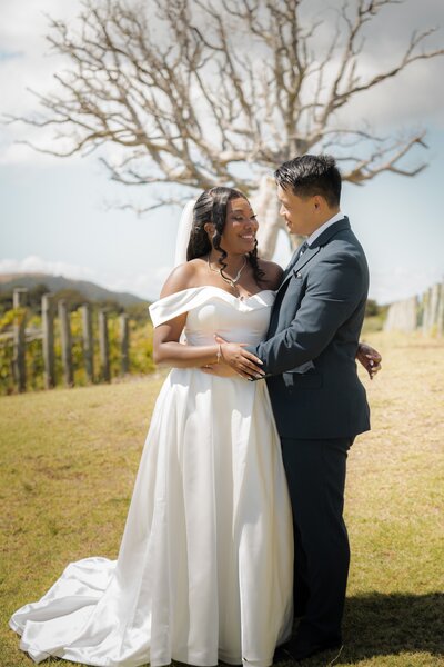 Newlywed first kiss at waiheke island vineyard wedding