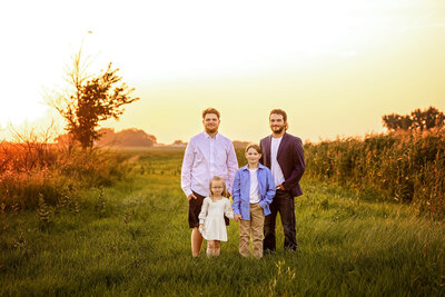Four children posed during golden hour in Southern Minnesota.
