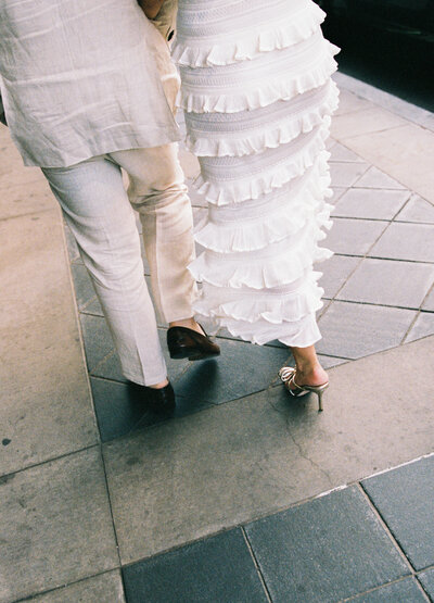 couple in the streets of downtown park city at their rehearsal dinner