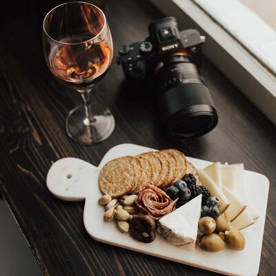 Flatlay with camera and snack board