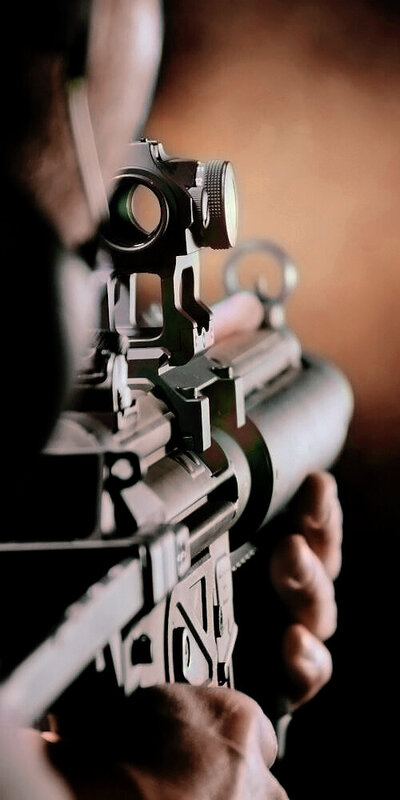 Professional video production capturing firearm shooting scenes for gun store promotional content