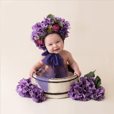 Cute Baby in A Purple Flower Bucket