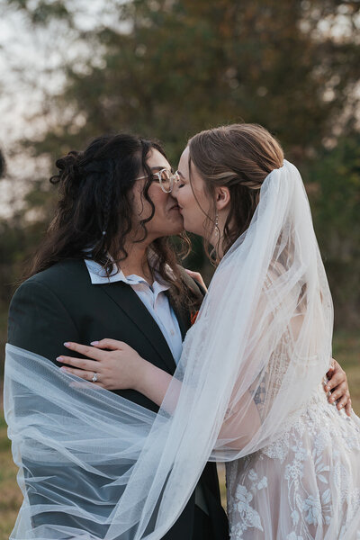 Two women kiss on their wedding day