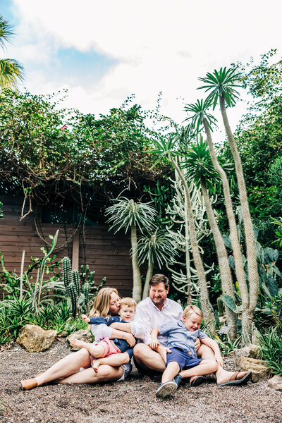 family cuddling at sunken gardens in st pete.