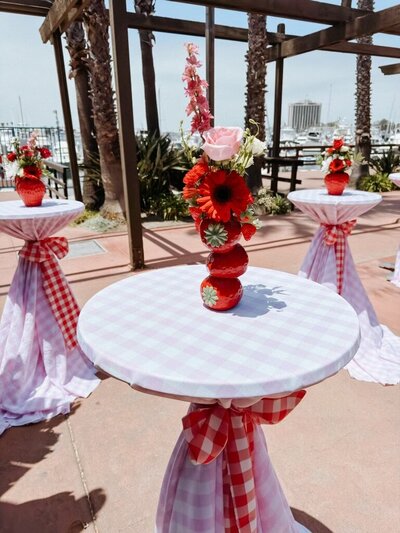 Table arrangements for berry themed birthday party planned by Fancy Chancey in San Diego CA