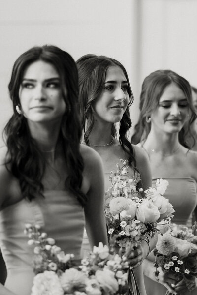 bridesmaid crying watching bride walk down aisle