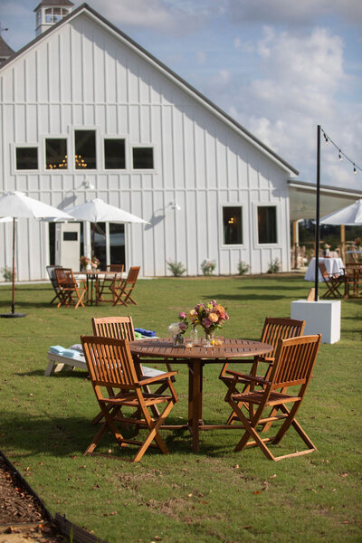 Wedding reception outdoor table with floral centerpiece