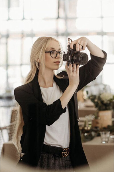 Jess Combs photographing looking to the right
