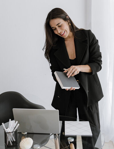 woman holding notebook