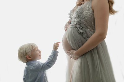 new Mother holding pregnant bell