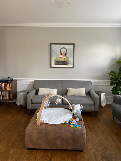 newborn baby artwork over couch