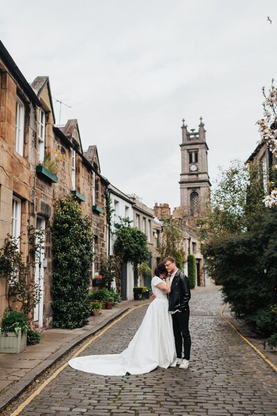 Bride and groom in. an alleyway for their Scotland wedding