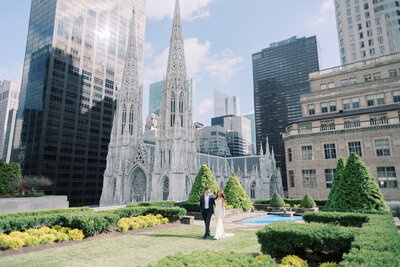 Couple share a few moments on their wedding day overlooking Rockefeller Center at 620 Loft and Gardens.