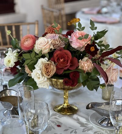 Gold floral compote with cream, sienna and burgundy florals. Warm wedding reception floral arrangements. Custom wedding florist based in Easton, MD.
