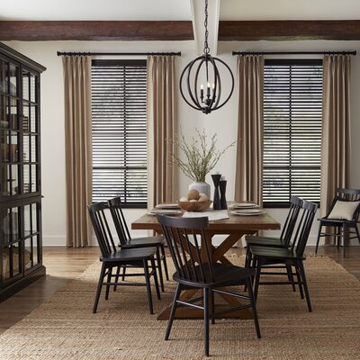 Dining room windows with classic blinds and curtains
