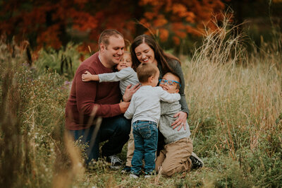 Warm family embrace in New Brighton, MN at Silverwood Park