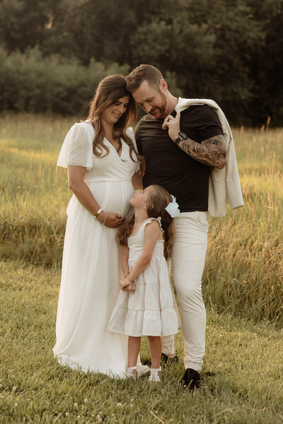 a family posing together at a New Jersey park for their family session