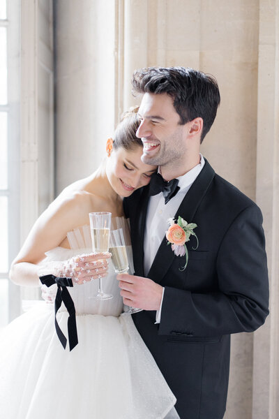 Bride and Groom in front of Eiffel tower in Paris france, photographed by destination wedding photographer brittany navin photography who is based out of Ottawa, ON.