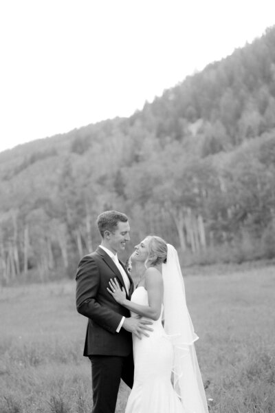 Candid black-and-white wedding portrait in Aspen, Colorado