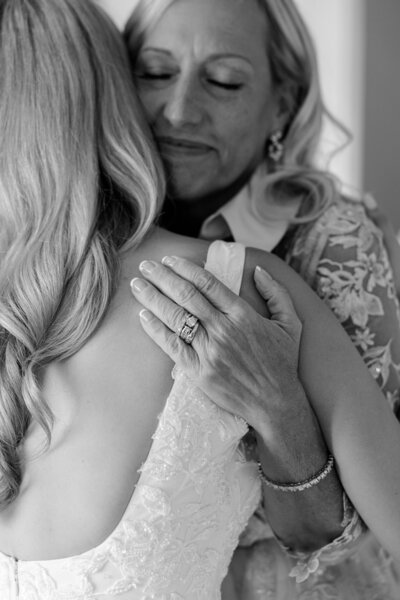 a bride hugging a family member