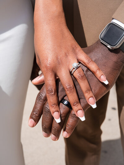 Detail shot of wedding rings and bridal bouquet during a City Hall elopement in Chicago.