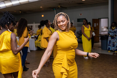 Women in yellow dancing