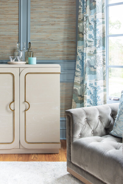 Chic interior in Lake Norman, NC, featuring bold wallpaper, soft furnishings, and elegant decor.