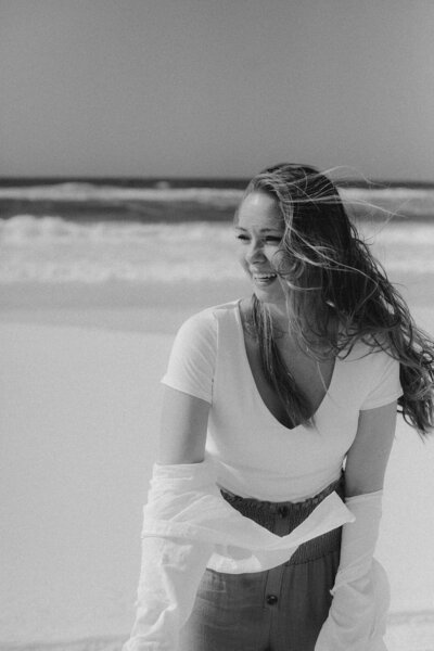 creative-bliss-studio-woman-smiling-on-the-beach