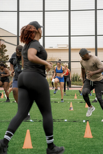 people running drills during bootcamp at Dick's House of Sport Tampa