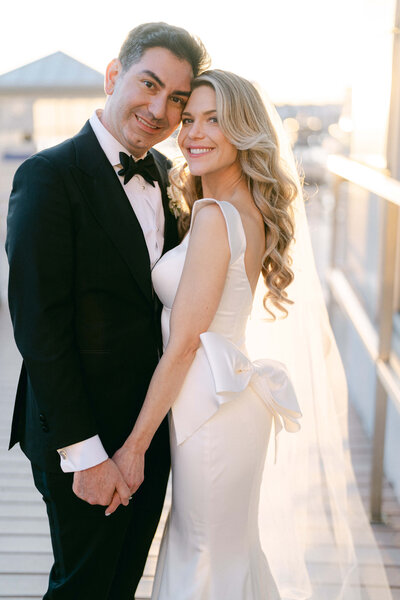 Bride and groom pictures at Rosewood Mansion on Turtle Creek, with the bride in a tulle gown and long veil